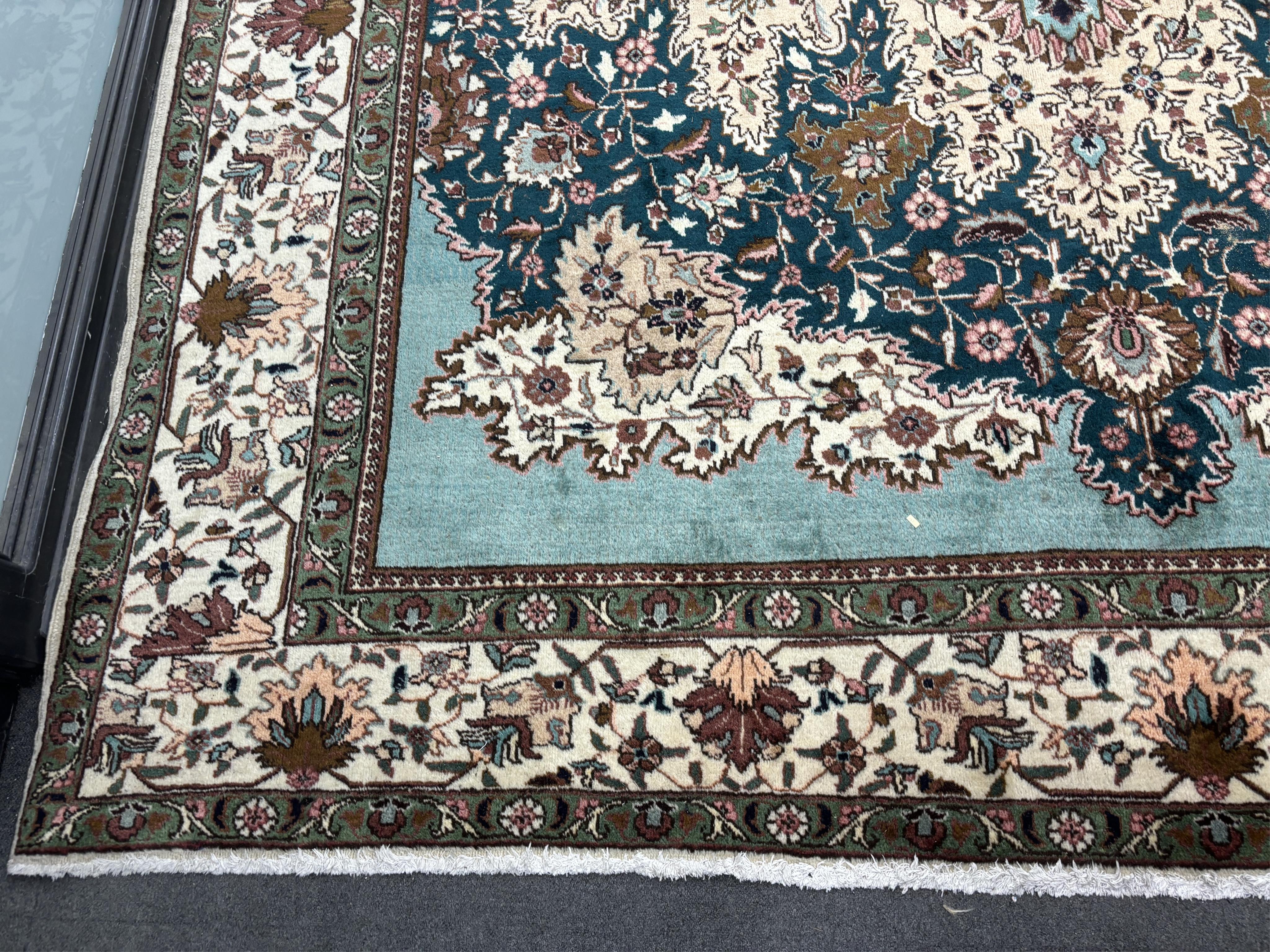 A Tabriz carpet, 400 x 310cm